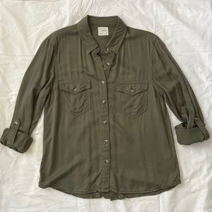 Super soft green button up! The sleeves also roll up and fasten with a button!